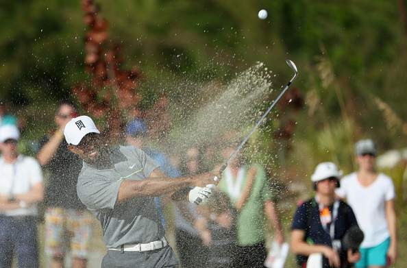 NASSAU, BAHAMAS - DECEMBER 03: Tiger Woods of the United States hits an approach shot on the 11th hole during round three of the Hero World Challenge at Albany, The Bahamas on December 3, 2016 in Nassau, Bahamas. (Photo by Christian Petersen/Getty Images)