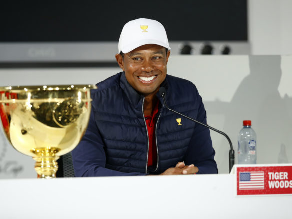MELBOURNE, AUSTRALIA - DECEMBER 15: Playing Captain Tiger Woods of the United States team speaks to the media as he celebrates with the trophy after they defeated the International team 16-14 during Sunday Singles matches on day four of the 2019 Presidents Cup at Royal Melbourne Golf Course on December 15, 2019 in Melbourne, Australia. (Photo by Daniel Pockett/Getty Images)